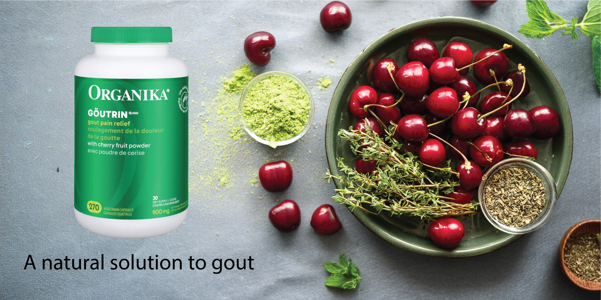 Organika bottle with cherries and herbs on a gray background natvd.com