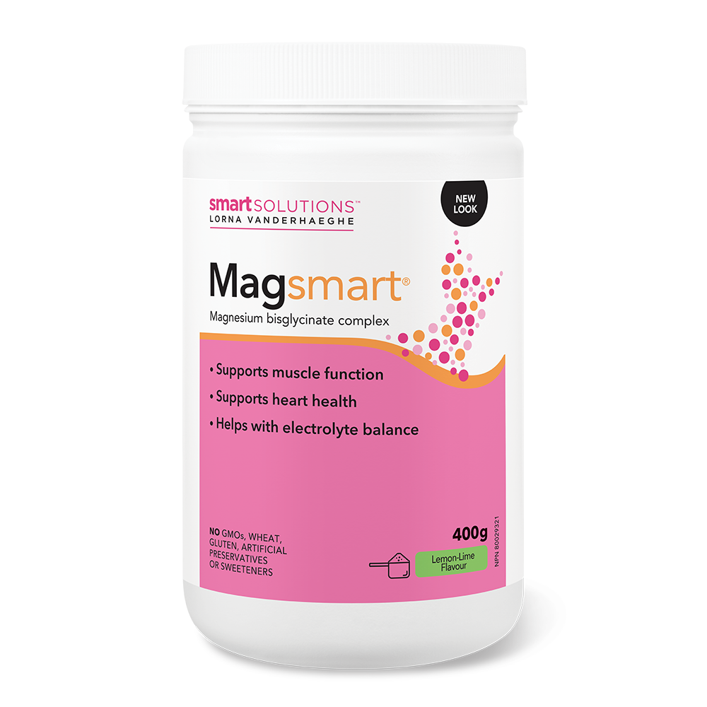 A container of Lorna Vanderhaeghe MAGsmart powder, which is labeled to support muscle function, heart health, and electrolyte balance. The container is white with a pink label and text, indicating a magnesium bisulfate complex with taurine and B vitamins.