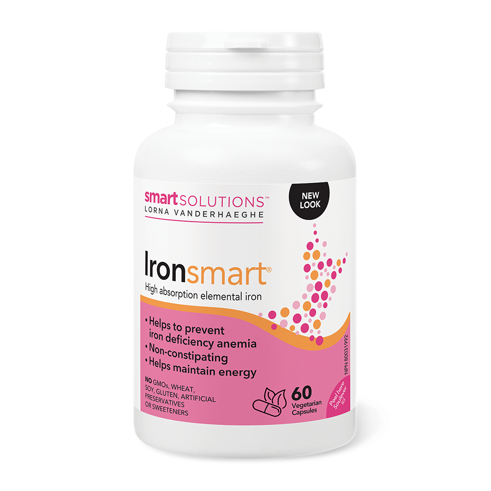 A bottle of Lorna Vanderhaeghe Ironsmart, high absorption elemental iron supplement, with 60 vegicaps. The packaging is white with pink and purple accents, and it's labeled for helping prevent iron deficiency anemia and maintaining energy.